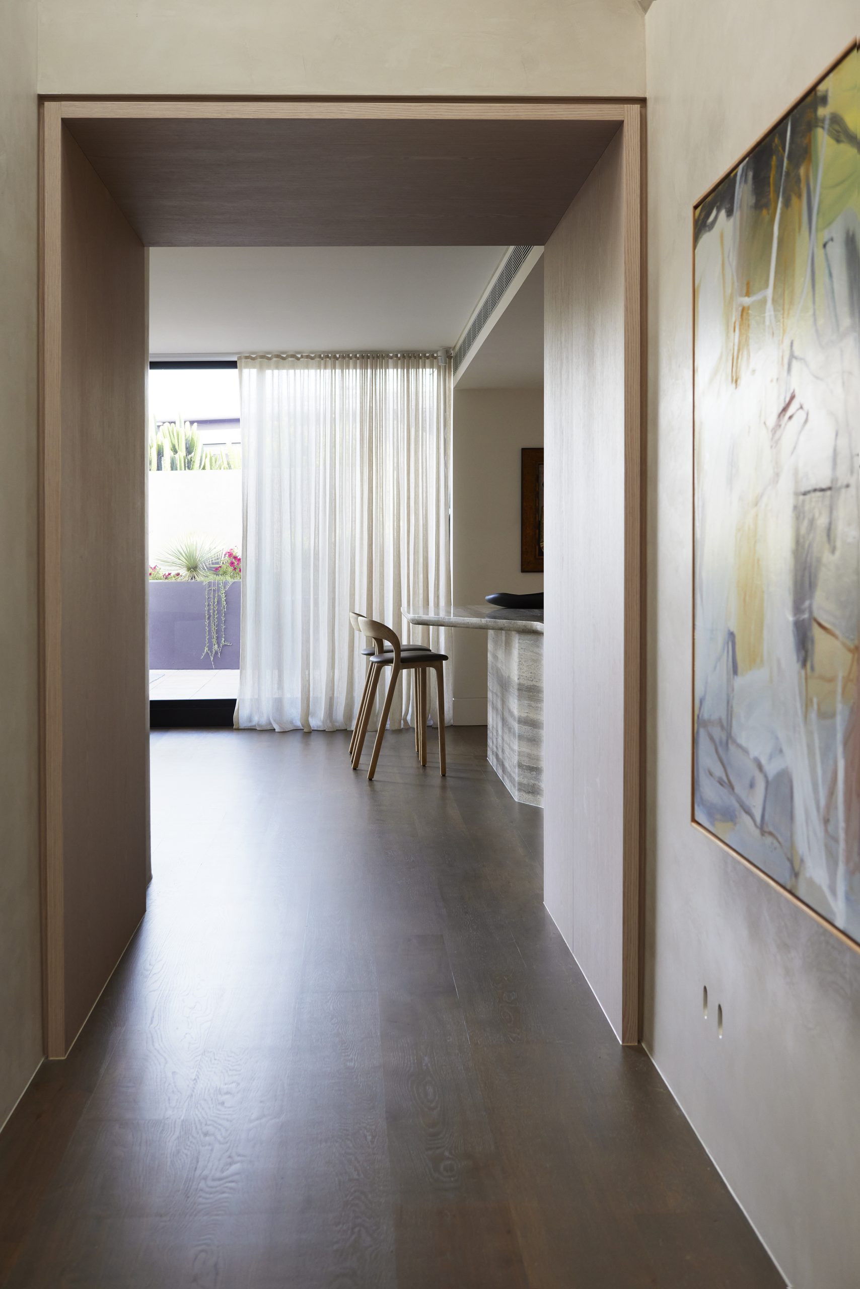 Skyline Penthouse study with built-in shelving and soft material palette by Hare + Klein