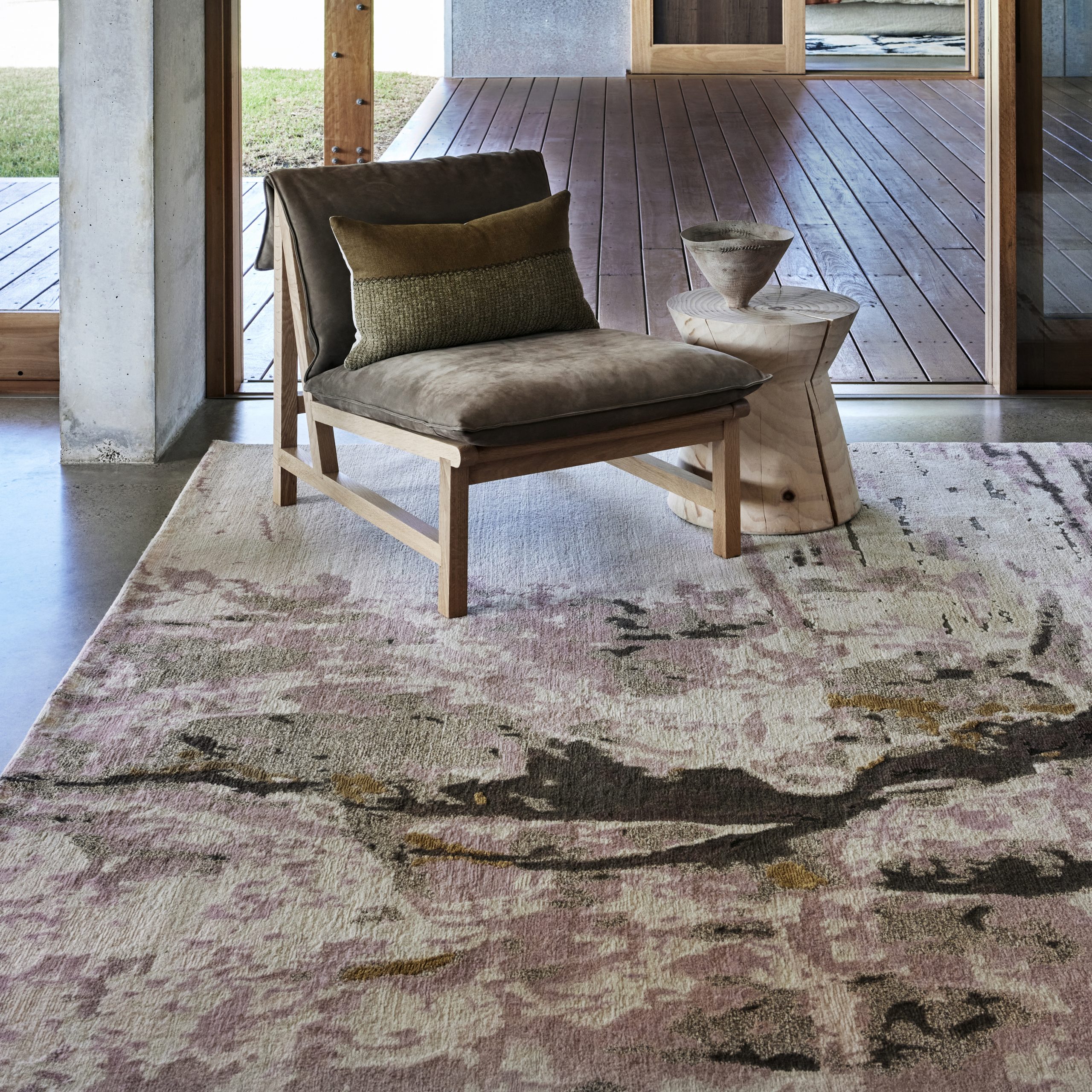 Timber deck styled with Crevasse rug, our fourth rug collection with Designer Rugs, wooden chair and stools